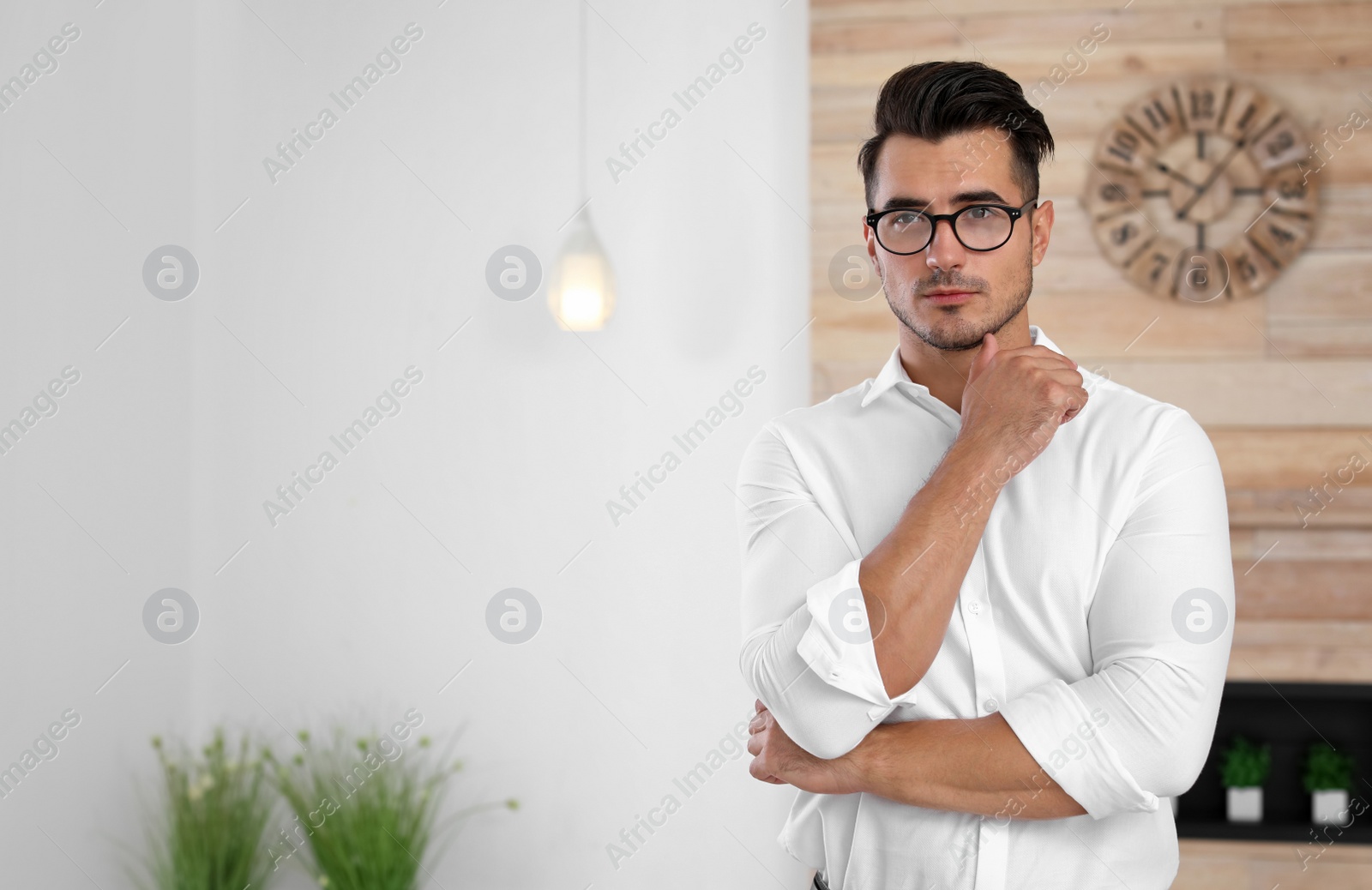Photo of Portrait of handsome young man in room