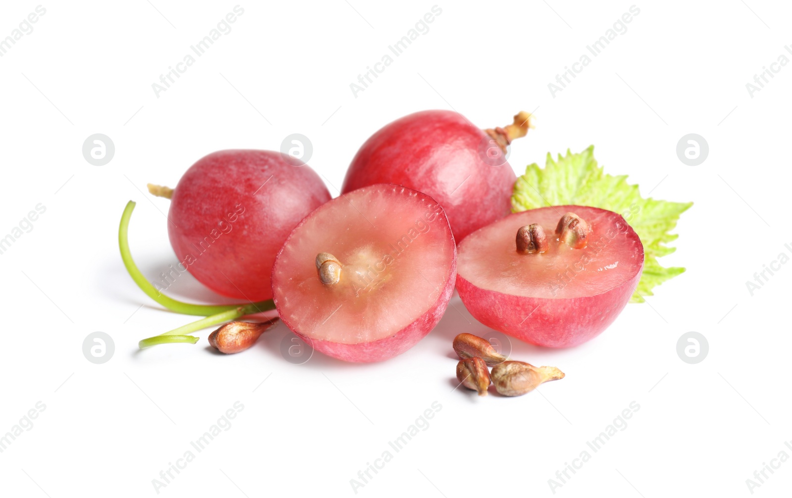 Photo of Organic red grapes and seeds on white background. Natural essential oil ingredient