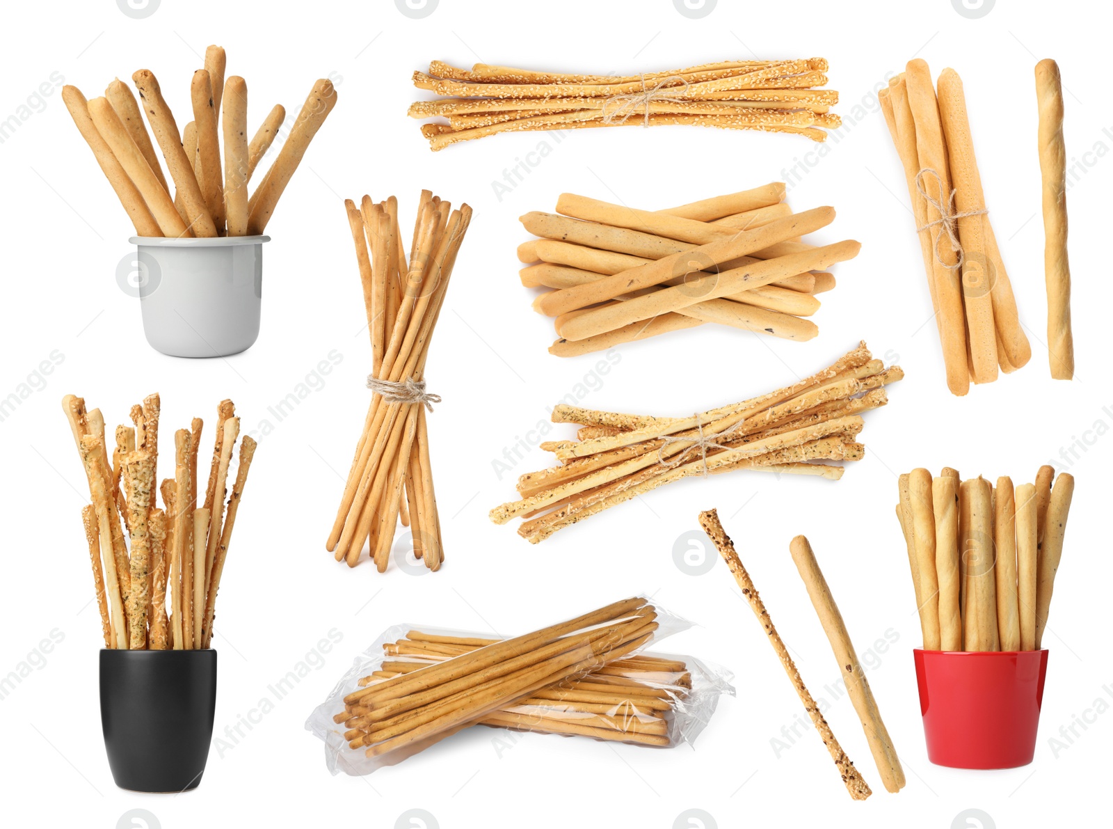 Image of Set with delicious crispy grissini sticks on white background