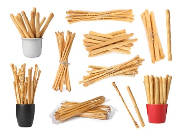 Set with delicious crispy grissini sticks on white background