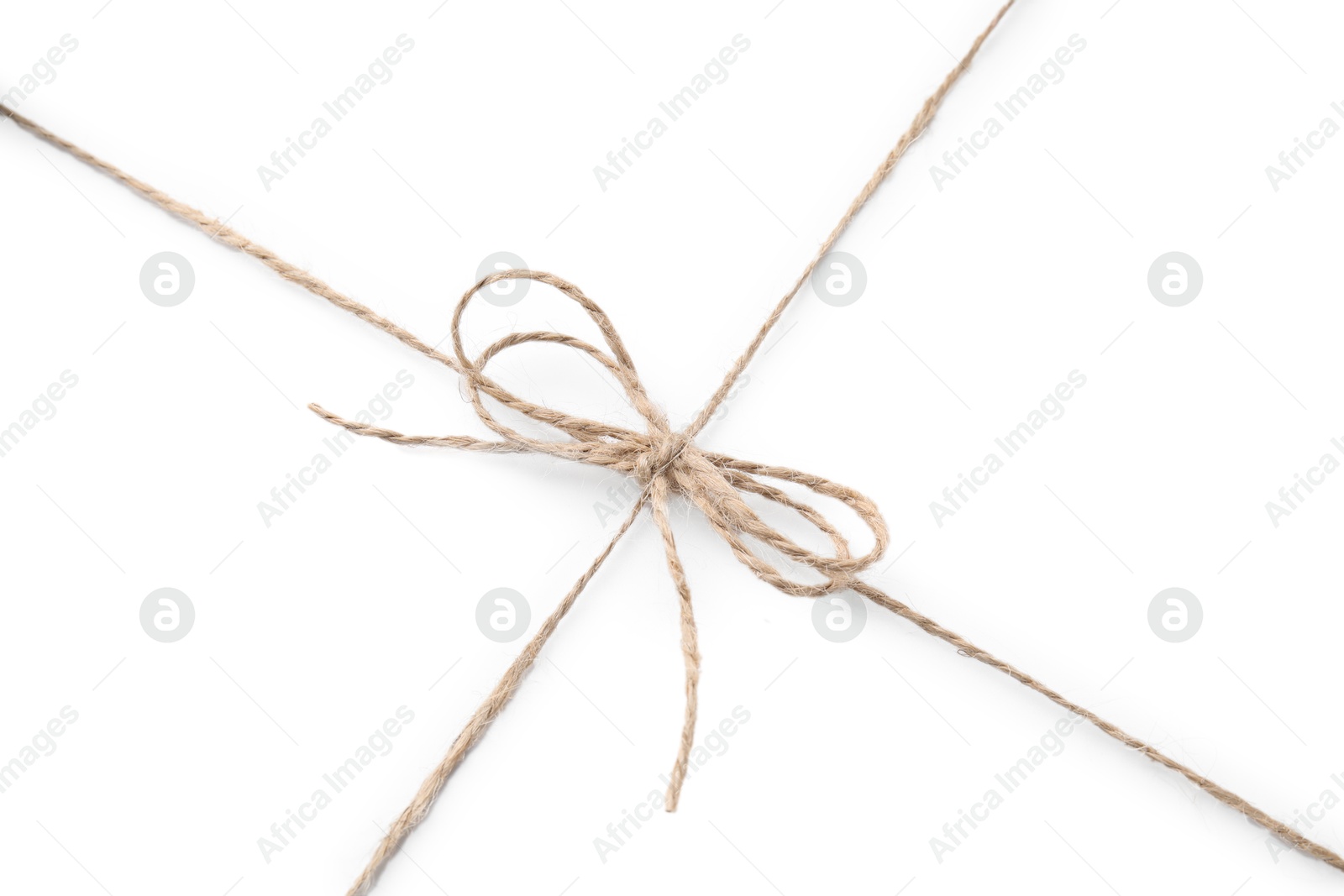 Photo of Linen rope string with bow isolated on white, top view