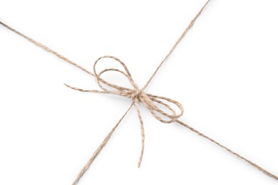 Linen rope string with bow isolated on white, top view