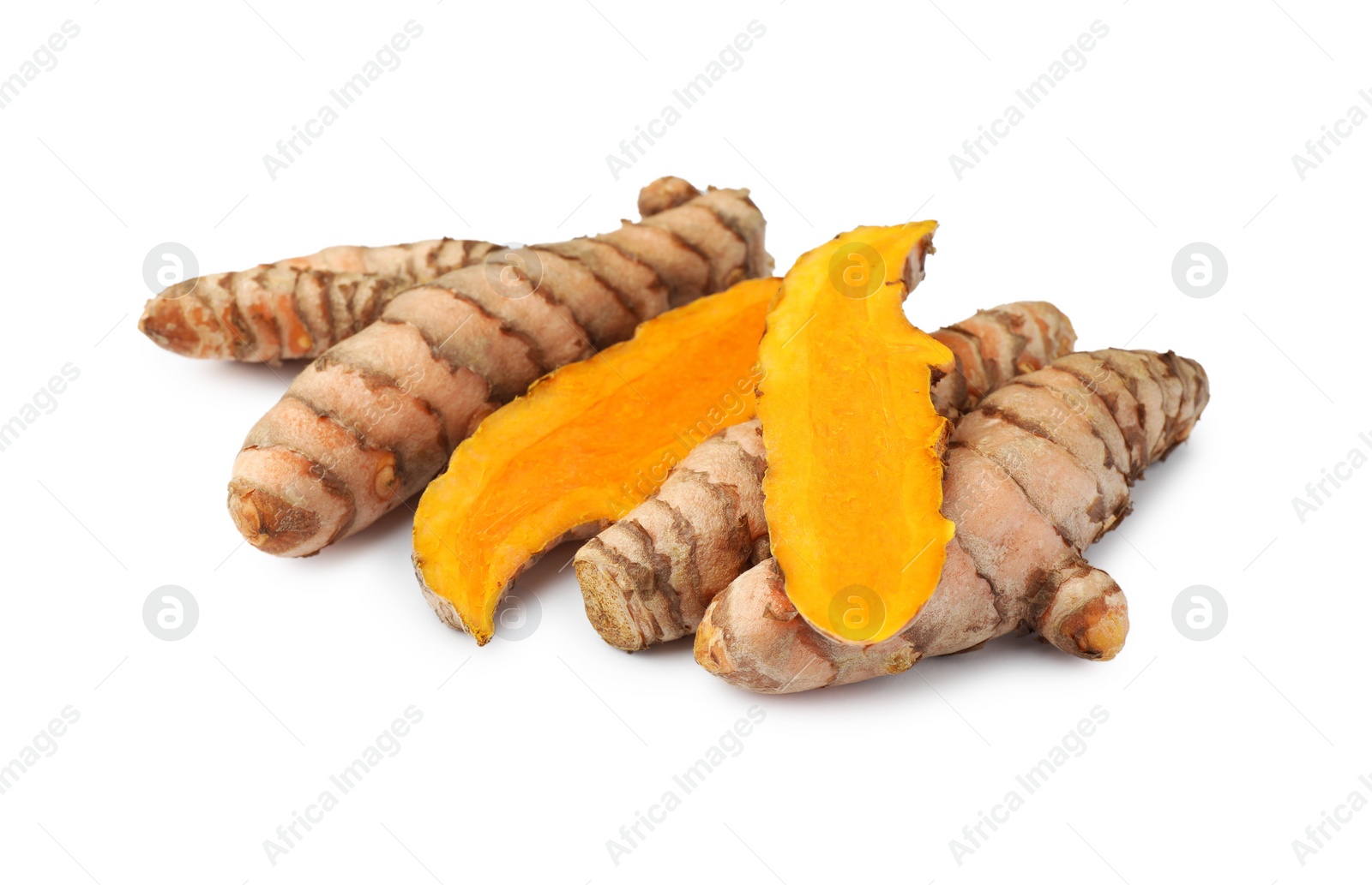 Photo of Whole and cut turmeric roots isolated on white