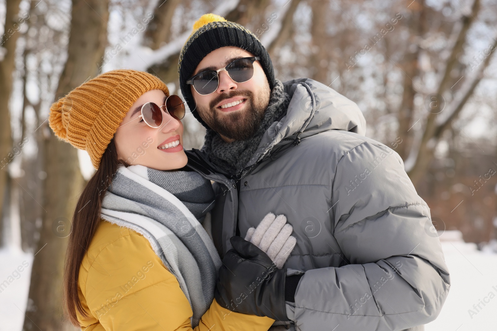 Photo of Beautiful happy couple spending time together on winter day