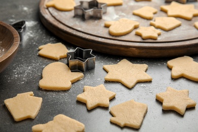 Photo of Raw Christmas cookies on table. Festive treats