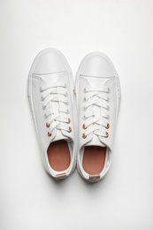 Photo of Pair of casual shoes on white background