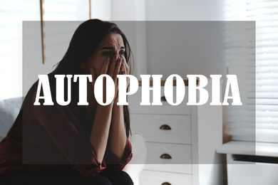 Image of Depressed young woman crying at home. Autophobia - fear of isolation