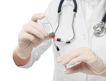 Photo of Doctor filling syringe with medication from glass vial on white background, closeup