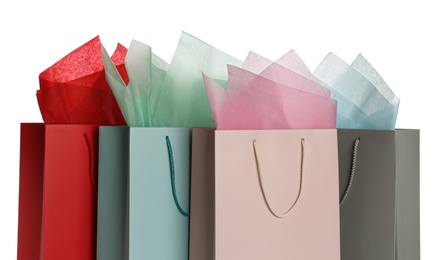 Photo of Gift bags with paper on white background