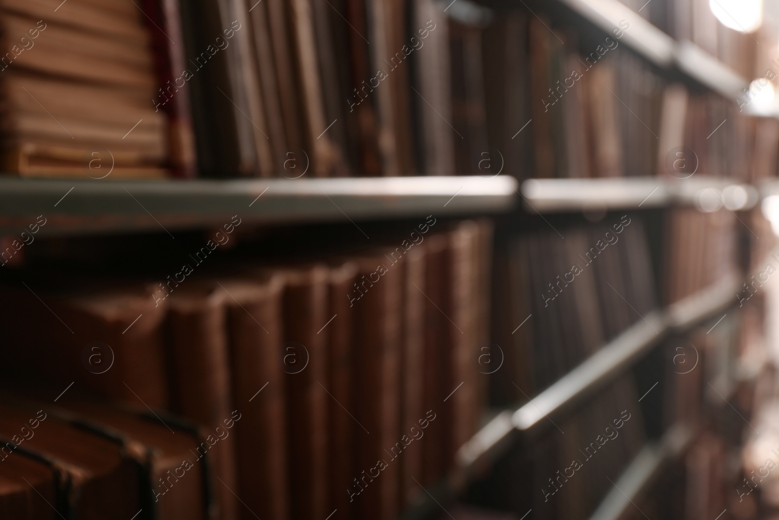 Photo of Blurred view of books on shelves in library