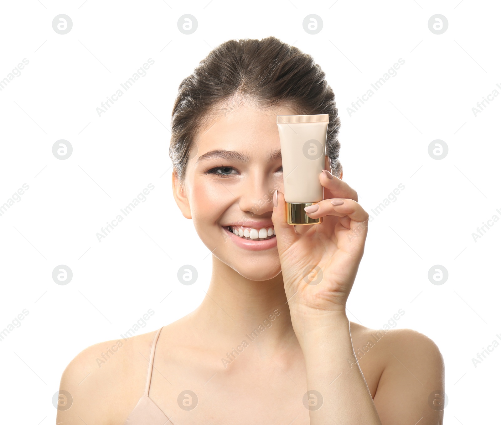 Photo of Beautiful girl with tube of foundation on white background