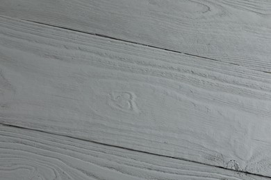 Photo of Texture of light grey wooden surface as background, closeup