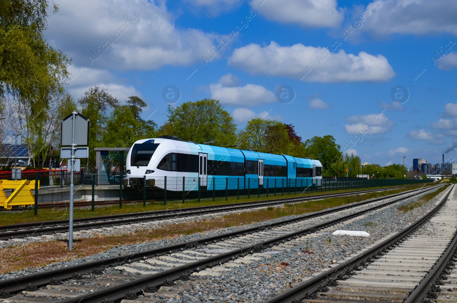 Photo of Railway lines and modern train on sunny day