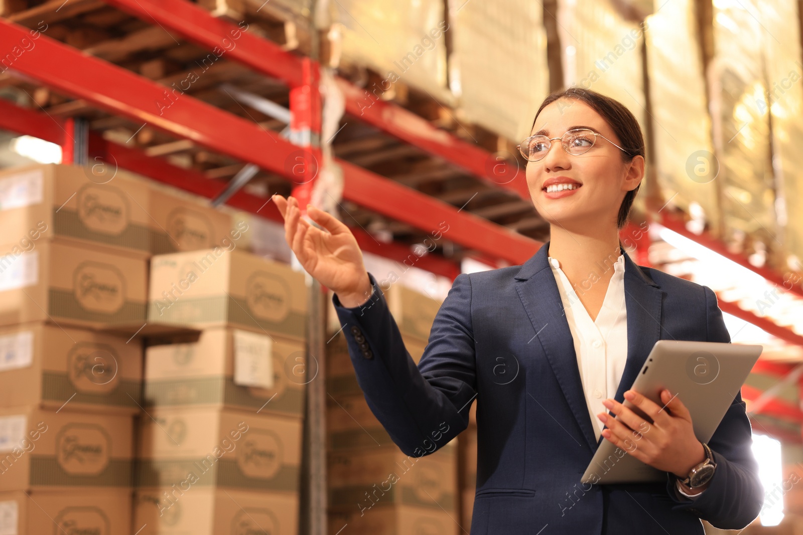 Image of Manager with tablet working at warehouse. Logistics center