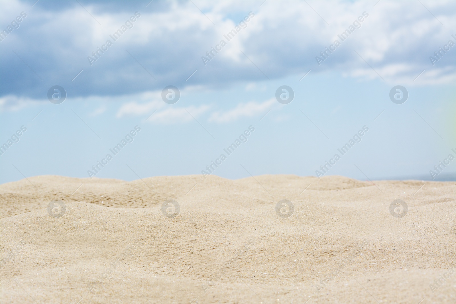 Photo of Beautiful view of sand in desert under cloudy sky