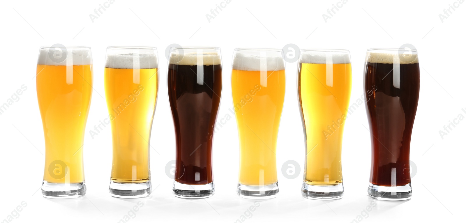 Photo of Glasses with different beer on white background