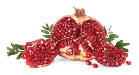 Fresh cut pomegranate and branches isolated on white