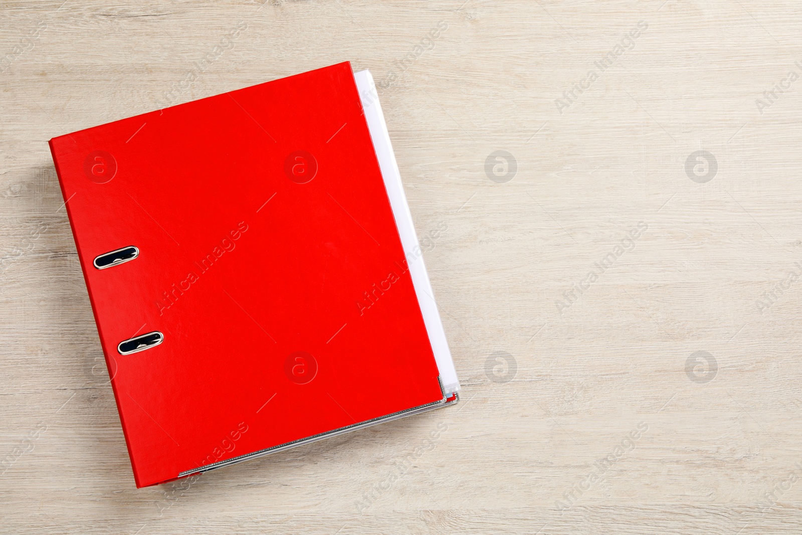 Photo of Red office folder on white wooden table, top view. Space for text