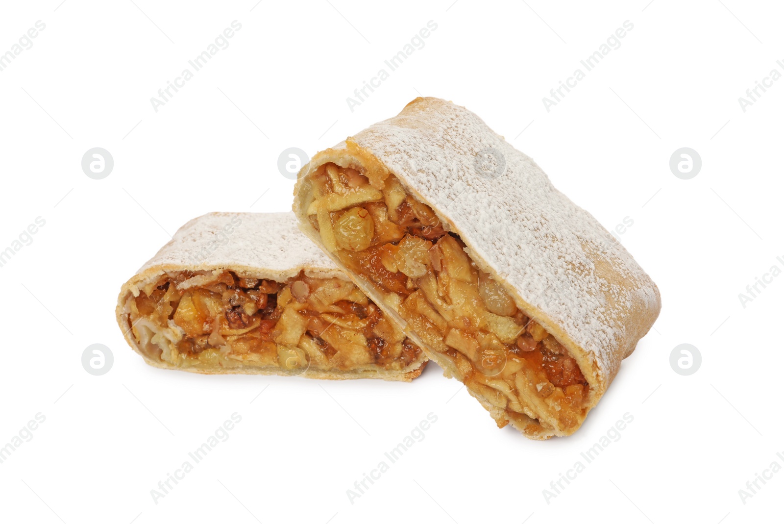 Photo of Delicious cut strudel with apples, nuts and raisins isolated on white