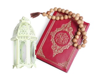 Photo of Decorative Arabic lantern, Quran and prayer beads on white background, top view