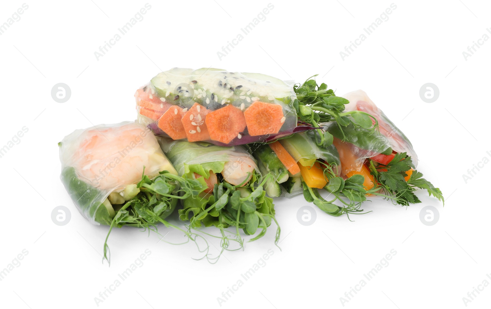 Photo of Many different delicious rolls wrapped in rice paper isolated on white