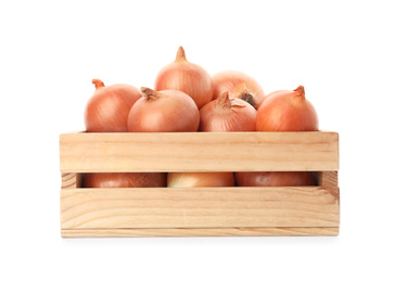 Photo of Fresh yellow onion bulbs in wooden crate isolated on white