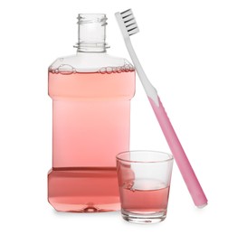 Photo of Mouthwash, glass and toothbrush on white background