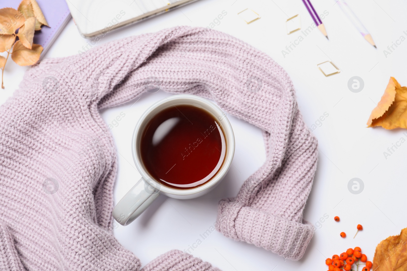 Photo of Composition with cup of hot drink on white background, top view. Cozy autumn atmosphere