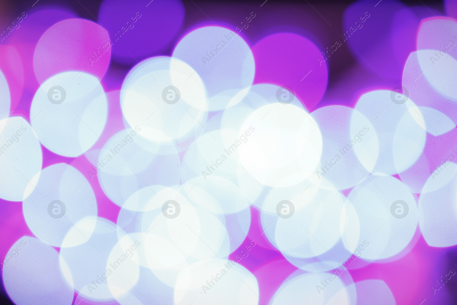 Photo of Beautiful glowing lights as background. Bokeh effect