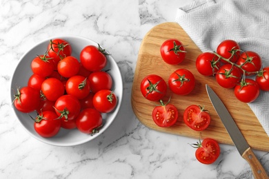 Flat lay composition with fresh cherry tomatoes on marble background