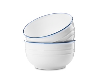 Clean empty ceramic bowls on white background