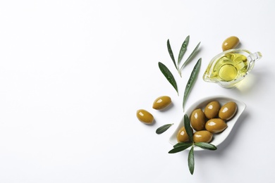 Photo of Beautiful composition with oil and ripe olives on white background