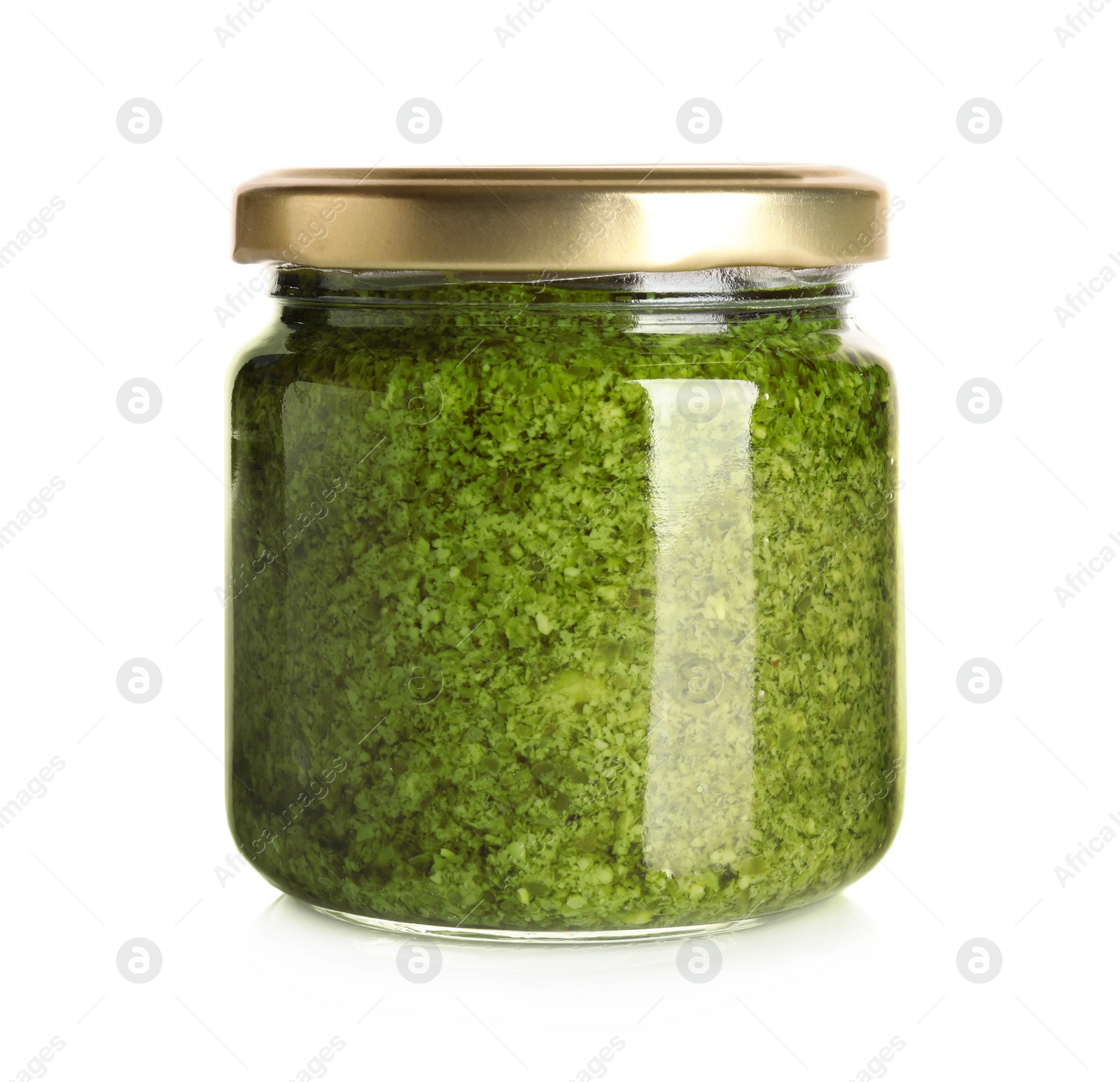 Photo of Jar of tasty arugula pesto on white background