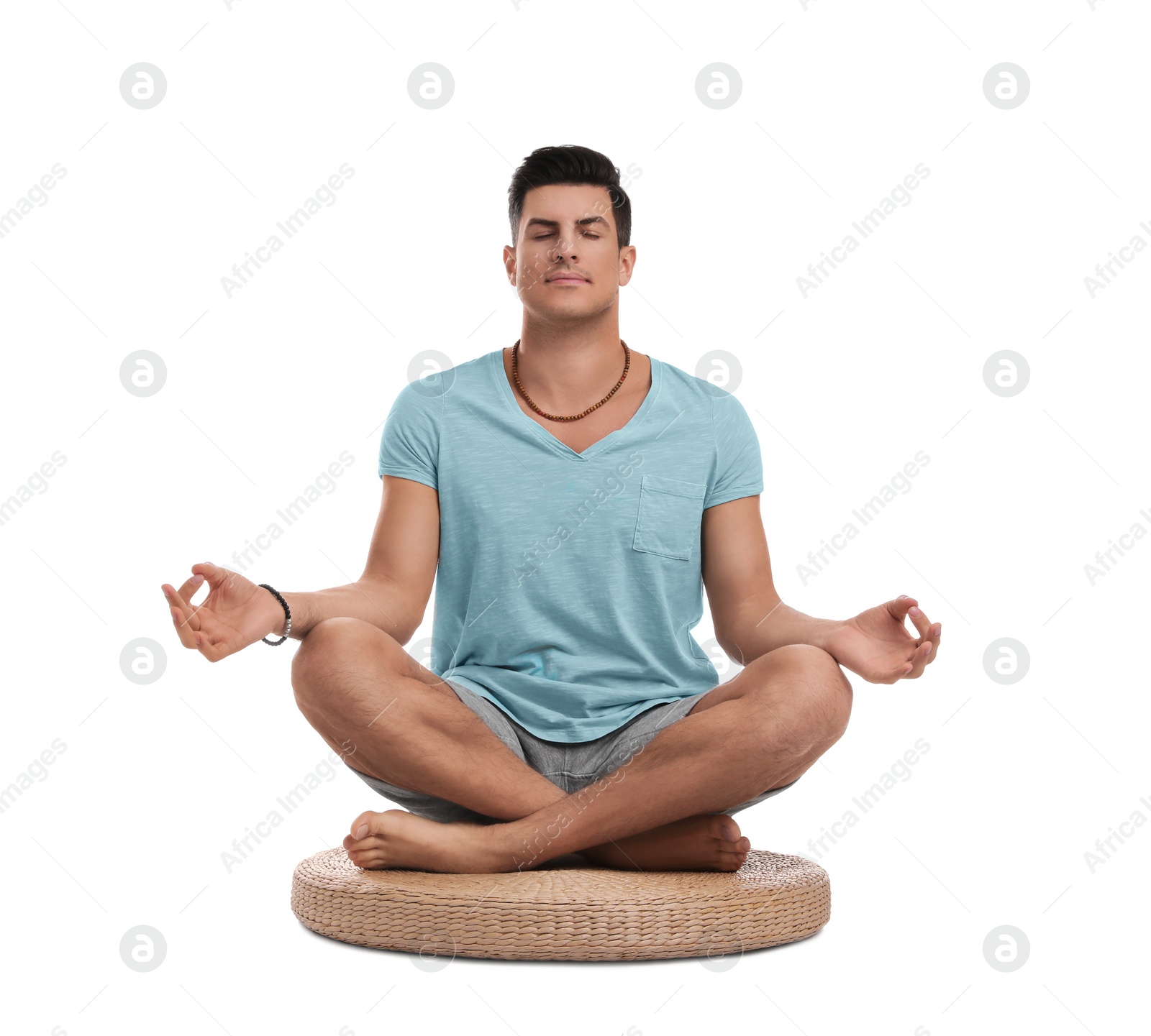 Photo of Man meditating on white background. Zen concept