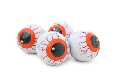 Delicious colorful candies in shape of eyes on white background. Halloween sweets