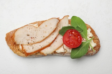 Photo of Delicious chicken bruschetta on white background, top view