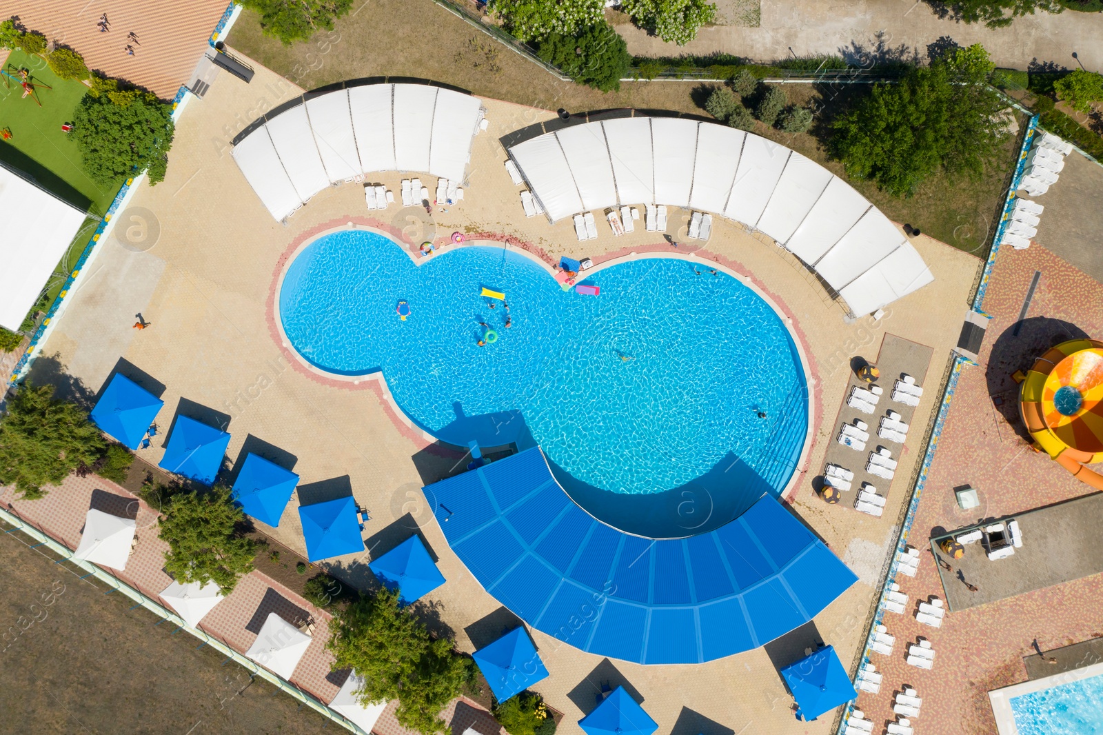 Image of Aerial view of swimming pool on sunny day