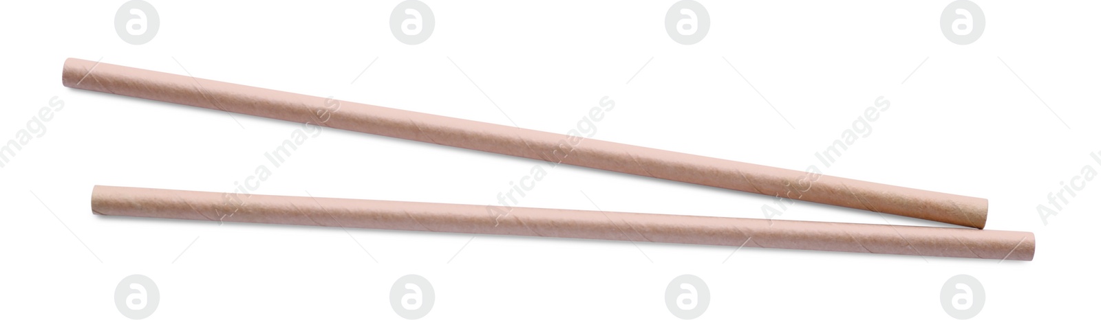 Photo of Beige paper cocktail straws on white background