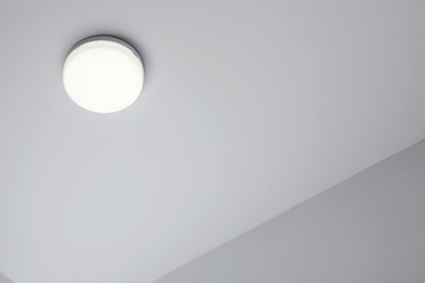 White modern lighting on ceiling in room, low angle view