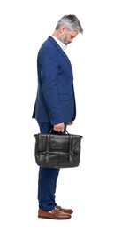 Photo of Mature businessman with briefcase posing on white background