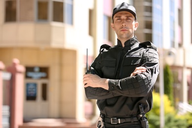 Photo of Portrait of male security guard in uniform outdoors