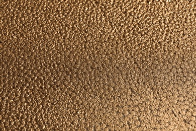 Photo of Beautiful view of rough golden surface as background