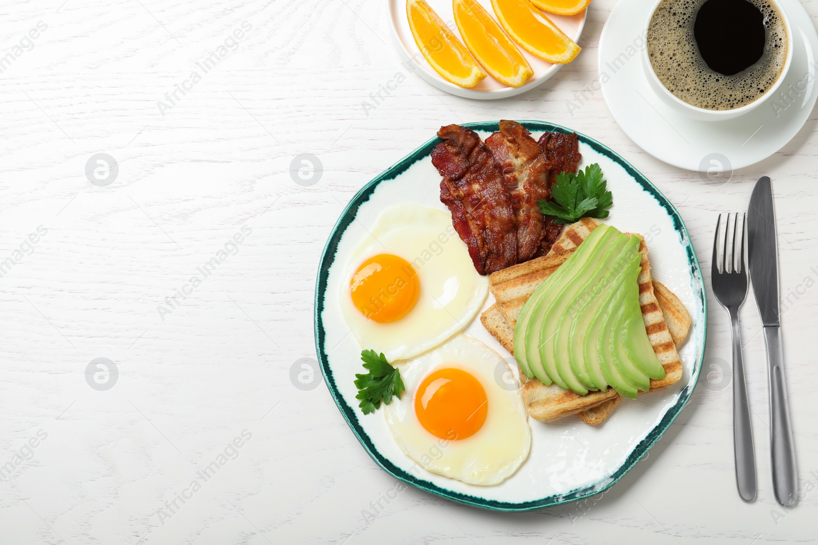 Photo of Healthy breakfast with fried eggs on white wooden table, flat lay. Space for text