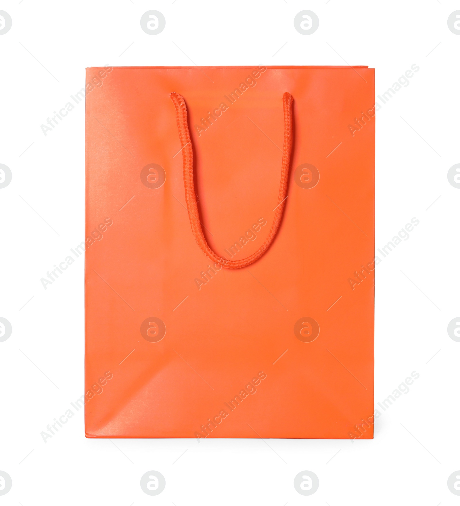 Photo of One orange shopping bag isolated on white