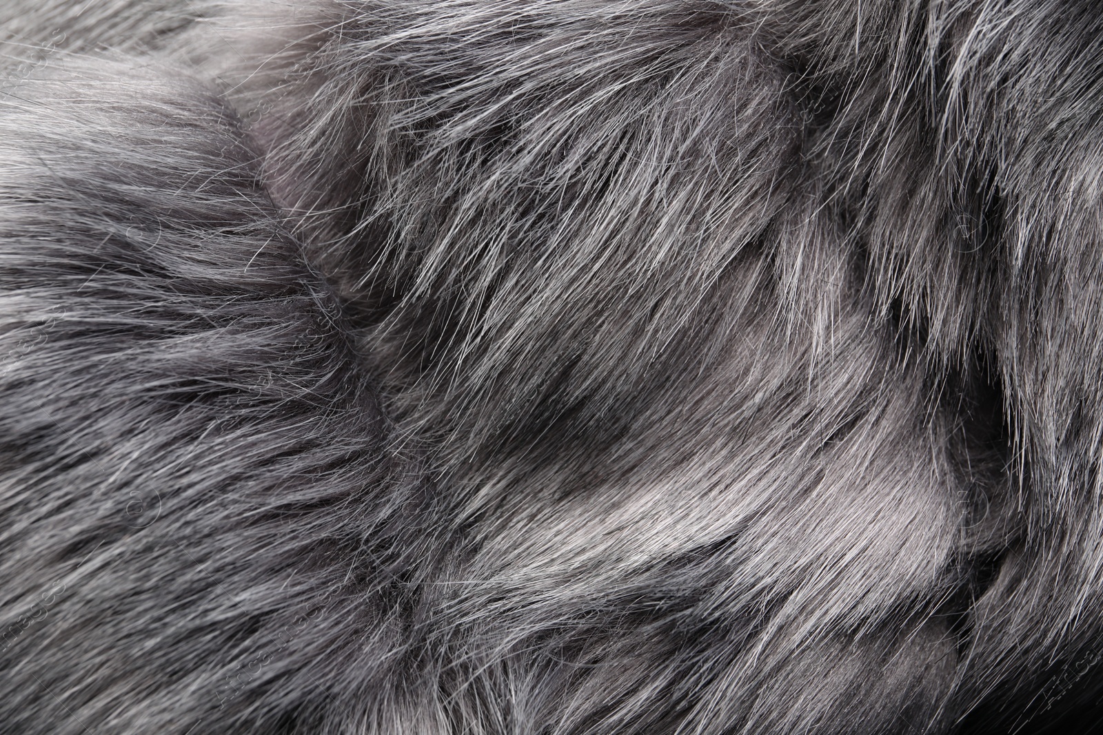 Photo of Texture of grey faux fur as background, closeup