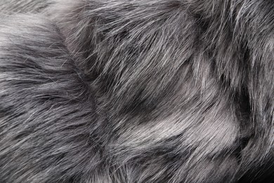 Texture of grey faux fur as background, closeup