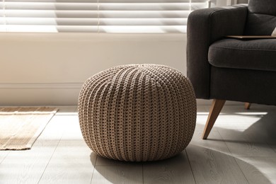 Stylish comfortable pouf in room. Home design