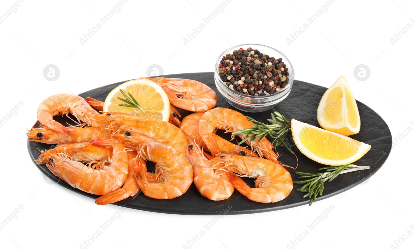 Photo of Delicious cooked shrimps served with lemon, pepper and rosemary on white background