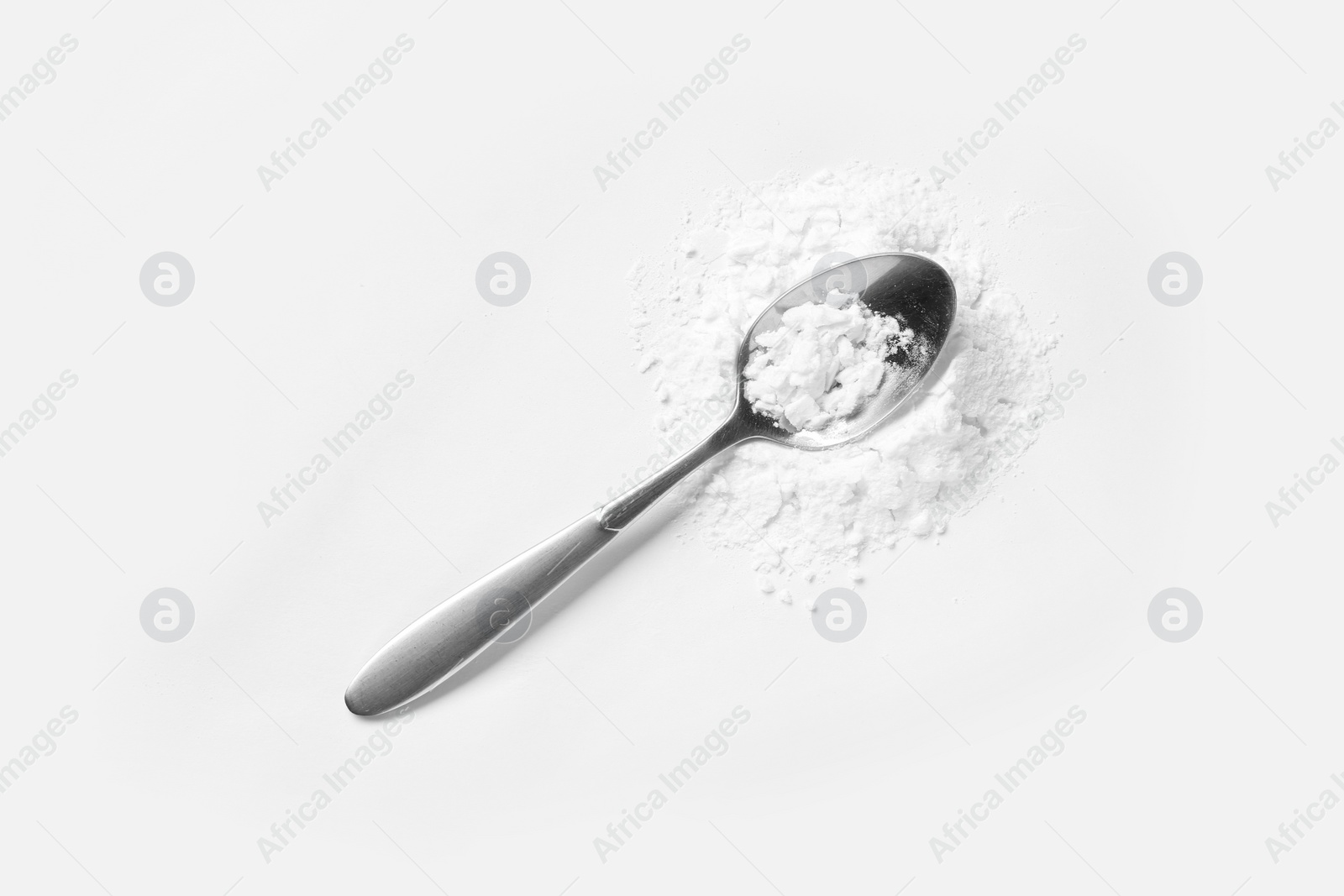 Photo of Spoon with cocaine powder on white background, top view