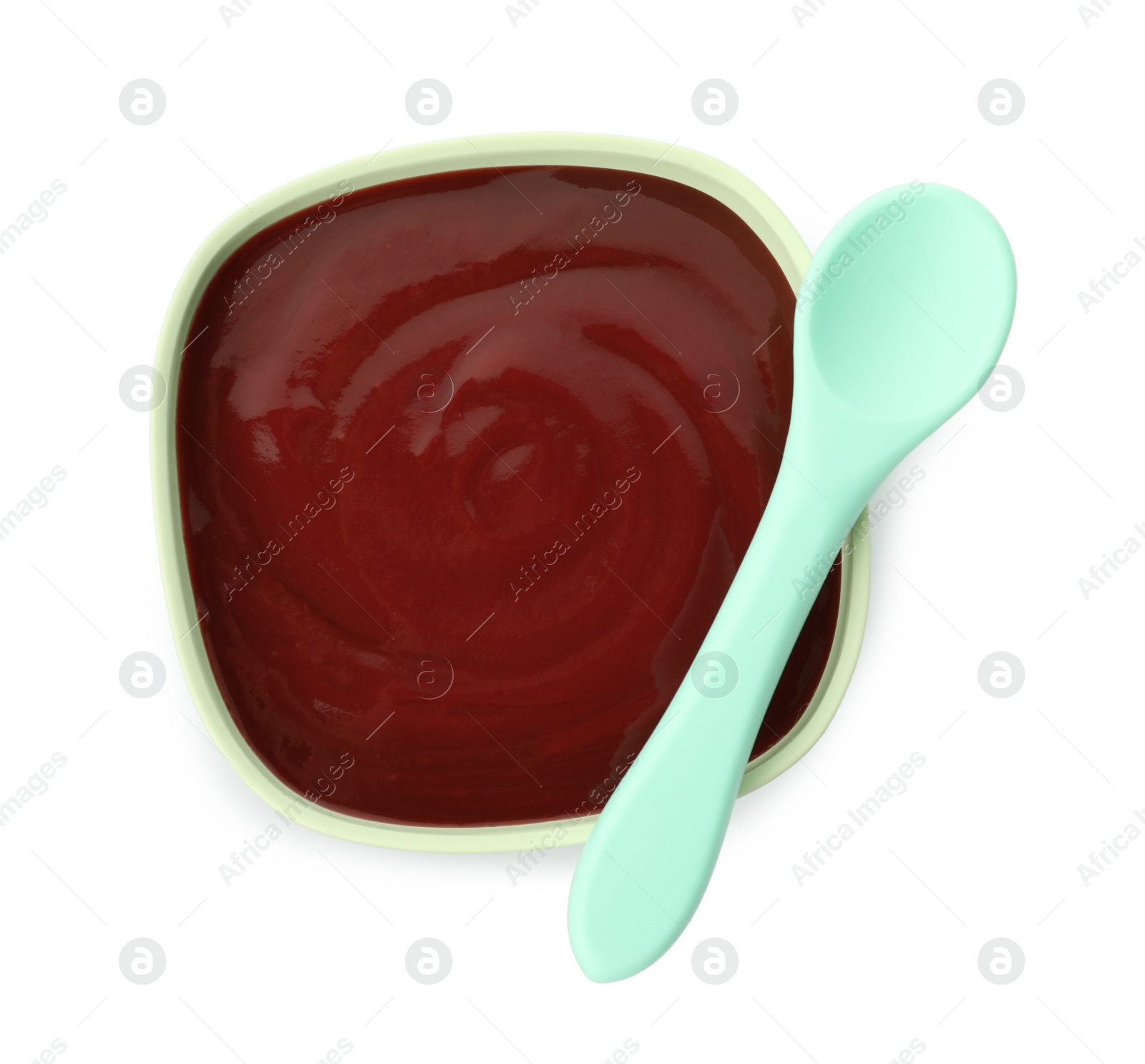 Photo of Bowl with tasty pureed baby food and spoon isolated on white, top view